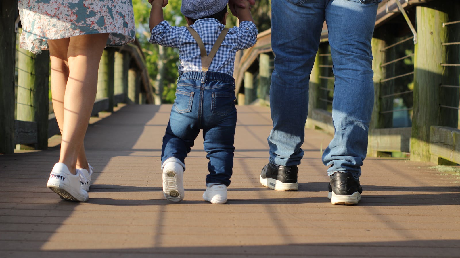 American family of four reviewing term and whole life insurance quotes with bilingual agent