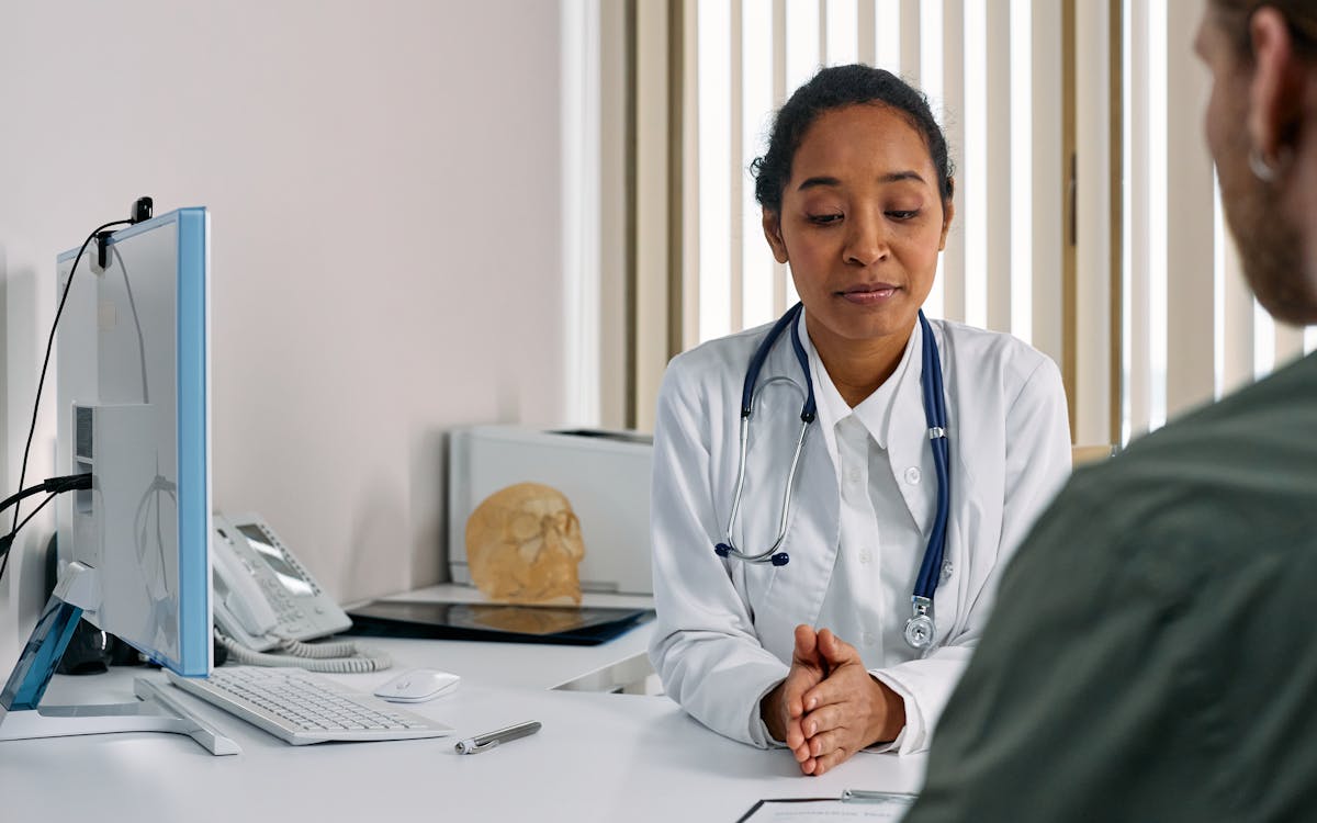 Doctor consulting a patient, representing ACA Marketplace coverage decisions for Florida families