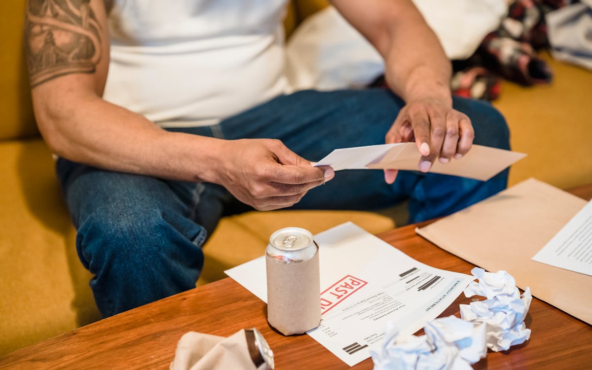 Older adult reviewing mail at home, representing the new 2026 paper Medicare cards