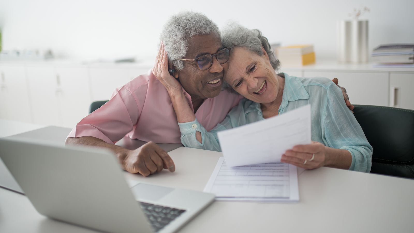 Retired Florida couple smiling while planning Roth conversions and withdrawals to manage MAGI and avoid Medicare IRMAA